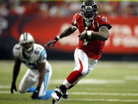 ATLANTA - DECEMBER 24:  (FILE) Quarterback Michael Vick #7 of the Atlanta Falcons runs the ball against the Carolina Panthers December 24, 2006 at The Georgia Dome in Atlanta,Georgia. According to reports on August 13, 2009, the Philadelphia Eagles have signed Vick to a two-year contract.  <br /><br /><span class="help">(Photo by Marc Serota/Getty Images)</span>