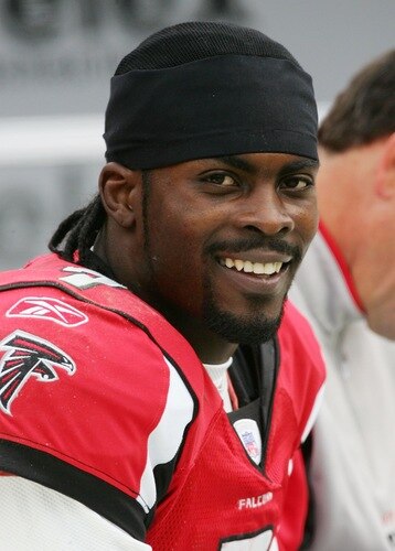 LANDOVER, MD - DECEMBER 03:  (FILE) Michael Vick #7 of the Atlanta Falcons smiles from the sidelines during a timeout of their game against the Washington Redskins on December 3, 2006 at FedEx Field in Landover, Maryland. According to reports on August 13, 2009, the Philadelphia Eagles have signed Vick to a two-year contract.  <br /><br /><span class="help">(Photo by Jim McIsaac/Getty Images)</span>