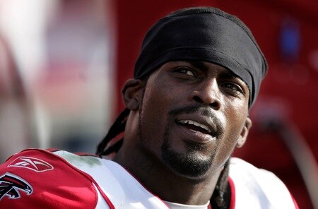 TAMPA, FL - DECEMBER 10:  (FILE) Quarterback Michael Vick #7 of the Atlanta Falcons watches his defense play against the Tampa Bay Buccaneers on December 10, 2006 at Raymond James Stadium in Tampa, Florida. According to reports on August 13, 2009, the Philadelphia Eagles have signed Vick to a two-year contract.  <br /><br /><span class="help">(Photo by Doug Pensinger/Getty Images)</span>