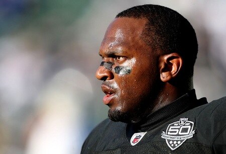 OAKLAND, CA - AUGUST 13:  Linebacker Kirk Morrison #52 of the Oakland Raiders looks on before the preseason game against the Dallas Cowboys at Oakland-Alameda County Coliseum on August 13, 2009 in Oakland, California. <br /><br /><span class="help">(Photo by Jed Jacobsohn/Getty Images)</span>