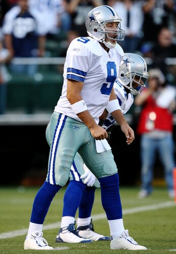 OAKLAND, CA - AUGUST 13:  Quarterback Tony Romo #9 of the Dallas Cowboys calls out a play at the line against the Oakland Raiders in the first quarter during the preseason game at Oakland-Alameda County Coliseum on August 13, 2009 in Oakland, California. <br /><br /><span class="help">(Photo by Jed Jacobsohn/Getty Images)</span>