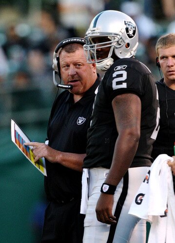OAKLAND, CA - AUGUST 13:  Head coach Tom Cable talks with his quarterback JaMarcus Russell #2 of the Oakland Raiders in the first quarter against the Dallas Cowboys during the preseason game at Oakland-Alameda County Coliseum on August 13, 2009 in Oakland, California. <br /><br /><span class="help">(Photo by Jed Jacobsohn/Getty Images)</span>