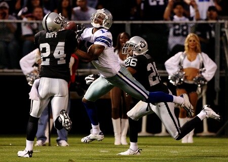 OAKLAND, CA - AUGUST 13: Safety Michael Huff #24 of the Oakland Raiders intercepts the ball over Sam Hurd #17 of the Dallas Cowboys during the preseason game at Oakland-Alameda County Coliseum on August 13, 2009 in Oakland, California. <br /><br /><span class="help">(Photo by Jed Jacobsohn/Getty Images)</span>