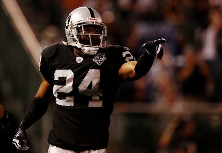 OAKLAND, CA - AUGUST 13:  Safety Michael Huff #24 of the Oakland Raiders celebrates after making an interception against the Dallas Cowboys during the preseason game at Oakland-Alameda County Coliseum on August 13, 2009 in Oakland, California. <br /><br /><span class="help">(Photo by Jed Jacobsohn/Getty Images)</span>