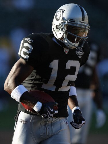 OAKLAND, CA - AUGUST 13:  Darrius Heyward-Bey #12 of the Oakland Raiders warms up against the Dallas Cowboys during a preseason game at Oakland-Alameda County Coliseum on August 13, 2009 in Oakland, California.  <br /><br /><span class="help">(Photo by Jed Jacobsohn/Getty Images)</span>