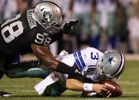 OAKLAND, CA - AUGUST 13: Defensive end Jay Richardson #98 of the Oakland Raiders sacks quarterback Jon Kitna #3 of the Dallas Cowboys after a bad snap during the preseason game at Oakland-Alameda County Coliseum on August 13, 2009 in Oakland, California. <br /><br /><span class="help">(Photo by Jed Jacobsohn/Getty Images)</span>