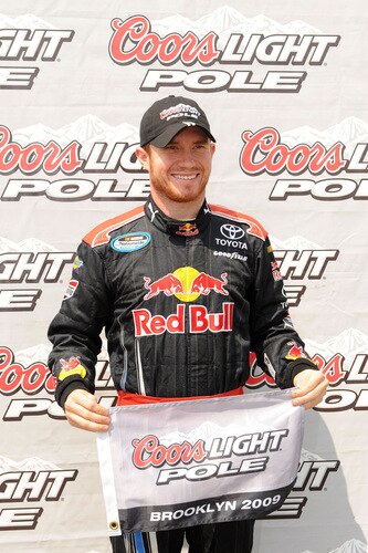 BROOKLYN, MI - AUGUST 15:  Brian Vickers, driver of the #32 Dollar General Stores Toyota, poses with the pole winner flag after he qualified first for the NASCAR Nationwide Series at Michigan Internetional Speedway on August 15, 2009 in Brooklyn, Michigan.  <br /><br /><span class="help">(Photo by Harry How/Getty Images)</span>