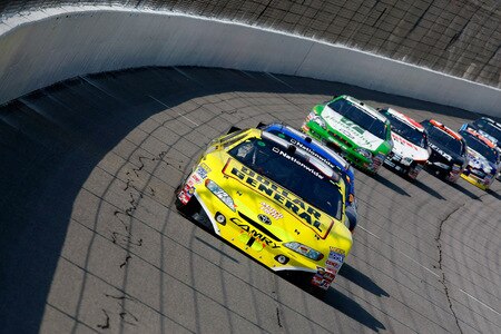 BROOKLYN, MI - AUGUST 15:  Brian Vickers , driver of the #32 Dollar General Stores Toyota, leads a pack of cars through turn one during the NASCAR Nationwide Series at Michigan International Speedway on August 15, 2009 in Brooklyn, Michigan.  <br /><br /><span class="help">(Photo by Jason Smith/Getty Images)</span>