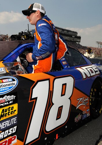 BROOKLYN, MI - AUGUST 15:  Kyle Busch, driver of the NOS Toyota, climbs into his car during the NASCAR Nationwide Series at Michigan International Speedway on August 15, 2009 in Brooklyn, Michigan.  <br /><br /><span class="help">(Photo by Rusty Jarrett/Getty Images for NASCAR)</span>