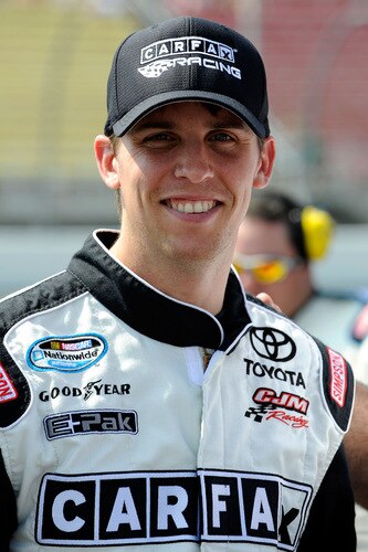 BROOKLYN, MI - AUGUST 15:  Denny Hamlin, driver of the #11 CARFAX Toyota, looks on from the grid during the NASCAR Nationwide Series at Michigan International Speedway on August 15, 2009 in Brooklyn, Michigan.  <br /><br /><span class="help">(Photo by John Harrelson/Getty Images for NASCAR)</span>