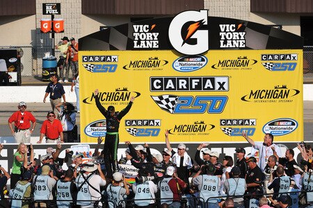BROOKLYN, MI - AUGUST 15:  Brad Keselowski, driver of the #88 GoDaddy Chevrolet, celebrates with his crew in victory lane after winning the NASCAR Nationwide Series at Michigan International Speedway on August 15, 2009 in Brooklyn, Michigan.  <br /><br /><span class="help">(Photo by Harry How/Getty Images)</span>