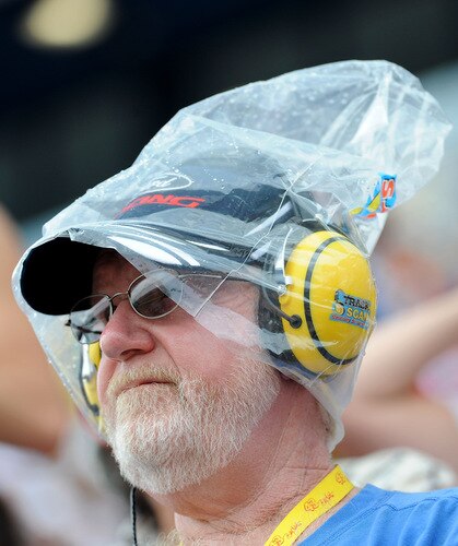 BROOKLYN, MI - AUGUST 16:  A fan covers his head with a plastice bag as rain falls during the NASCAR Sprint Cup Series CARFAX 400 at Michigan International Speedway on August 16, 2009 in Brooklyn, Michigan.  <br /><br /><span class="help">(Photo by Harry How/Getty Images)</span>