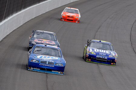 BROOKLYN, MI - AUGUST 16:  Kurt Busch, driver of the #2 Miller Lite Dodge, leads Brian Vickers, driver of the #83 Red Bull Toyota, Jimmie Johnson (R), driver of the #48 Lowe's Chevrolet and Joey Logano, driver of the #20 The Home Depot Toyota, during the NASCAR Sprint Cup Series CARFAX 400 at Michigan International Speedway on August 16, 2009 in Brooklyn, Michigan.  <br /><br /><span class="help">(Photo by Harry How/Getty Images)</span>