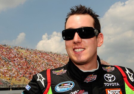 BROOKLYN, MI - AUGUST 16:  Kyle Busch, driver of the #18 Interstate Batteries Toyota, looks on from the grid during the NASCAR Sprint Cup Series CARFAX 400 at Michigan International Speedway on August 16, 2009 in Brooklyn, Michigan.  <br /><br /><span class="help">(Photo by Rusty Jarrett/Getty Images for NASCAR)</span>