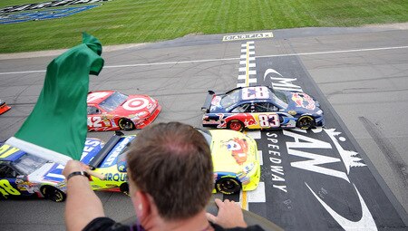 BROOKLYN, MI - AUGUST 16:  Brian Vickers, driver of the #83 Red Bull Toyota, leads the field at the start of during the NASCAR Sprint Cup Series CARFAX 400 at Michigan International Speedway on August 16, 2009 in Brooklyn, Michigan.  <br /><br /><span class="help">(Photo by Harry How/Getty Images)</span>
