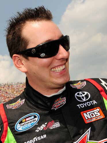 BROOKLYN, MI - AUGUST 16:  Kyle Busch, driver of the #18 Interstate Batteries Toyota, looks on from the grid during the NASCAR Sprint Cup Series CARFAX 400 at Michigan International Speedway on August 16, 2009 in Brooklyn, Michigan.  <br /><br /><span class="help">(Photo by Rusty Jarrett/Getty Images for NASCAR)</span>