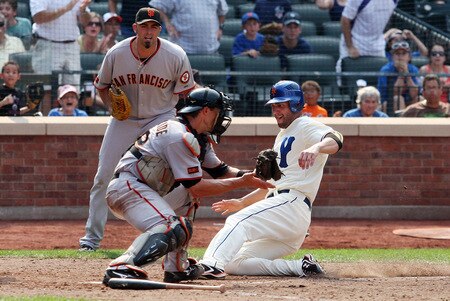 NEW YORK - AUGUST 16:  Jeff Francoeur #12 of the New York Mets beats the tag from Eli Whiteside #22 of the San Francisco Giants to score the winning run in the ninth inning on August 16, 2009 at Citi Field in the Flushing neighborhood of the Queens borough of New York City.  <br /><br /><span class="help">(Photo by Jim McIsaac/Getty Images)</span>