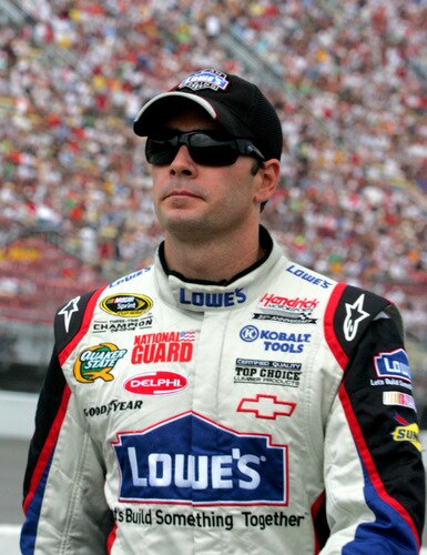 BROOKLYN, MI - AUGUST 16:  Jimmie Johnson, driver of the #48 Lowe's Chevrolet, looks on from the grid during the NASCAR Sprint Cup Series CARFAX 400 at Michigan International Speedway on August 16, 2009 in Brooklyn, Michigan.  <br /><br /><span class="help">(Photo by Jerry Markland/Getty Images for NASCAR)</span>