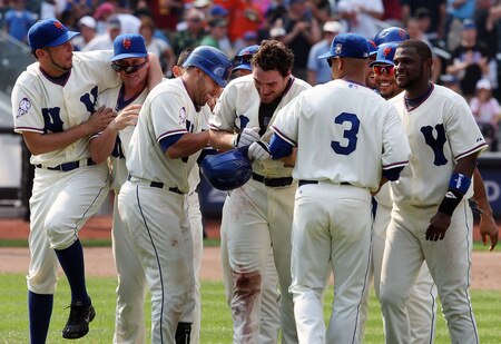 NEW YORK - AUGUST 16:  Daniel Murphy #28 (C) of the New York Mets celebrates his game winning hit against the San Francisco Giants with his teammates on August 16, 2009 at Citi Field in the Flushing neighborhood of the Queens borough of New York City.  <br /><br /><span class="help">(Photo by Jim McIsaac/Getty Images)</span>