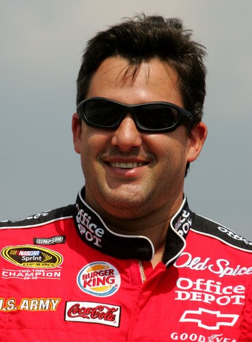 BROOKLYN, MI - AUGUST 16:  Tony Stewart, driver of the #14 Office Depot Chevrolet, looks on from the grid during the NASCAR Sprint Cup Series CARFAX 400 at Michigan International Speedway on August 16, 2009 in Brooklyn, Michigan.  <br /><br /><span class="help">(Photo by Jerry Markland/Getty Images for NASCAR)</span>