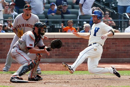 NEW YORK - AUGUST 16: Jeff Francoeur #12 of the New York Mets beats the throw to Eli Whiteside #22 of the San Francisco Giants to score the winning run in the ninth inning on August 16, 2009 at Citi Field in the Flushing neighborhood of the Queens borough of New York City.  <br /><br /><span class="help">(Photo by Jim McIsaac/Getty Images)</span>