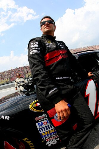 BROOKLYN, MI - AUGUST 16:  David Stremme, driver of the #12 No. 12 Penske Dodge Dodge, looks on from the grid during the NASCAR Sprint Cup Series CARFAX 400 at Michigan International Speedway on August 16, 2009 in Brooklyn, Michigan.  <br /><br /><span class="help">(Photo by Jason Smith/Getty Images)</span>