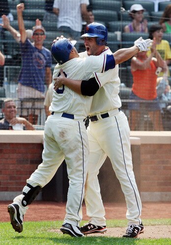NEW YORK - AUGUST 16:  Jeff Francoeur #12 of the New York Mets celebrates after scoring the winning run against the San Francisco Giants with teammate Omir Santos #9 in the ninth inning on August 16, 2009 at Citi Field in the Flushing neighborhood of the Queens borough of New York City.  <br /><br /><span class="help">(Photo by Jim McIsaac/Getty Images)</span>
