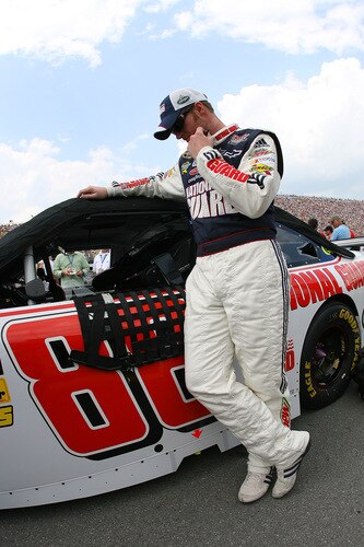 BROOKLYN, MI - AUGUST 16:  Dale Earnhardt Jr., driver of the #88 National Guard / AMP Energy Chevrolet, hans his head as he stands on the grid during the NASCAR Sprint Cup Series CARFAX 400 at Michigan International Speedway on August 16, 2009 in Brooklyn, Michigan.  <br /><br /><span class="help">(Photo by Jason Smith/Getty Images)</span>