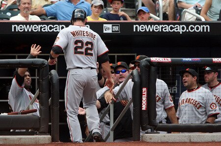 NEW YORK - AUGUST 16:  Eli Whiteside #22 of the San Francisco Giants is congratulated after scoring in the fifth inning against the New York Mets on August 16, 2009 at Citi Field in the Flushing neighborhood of the Queens borough of New York City.  <br /><br /><span class="help">(Photo by Jim McIsaac/Getty Images)</span>