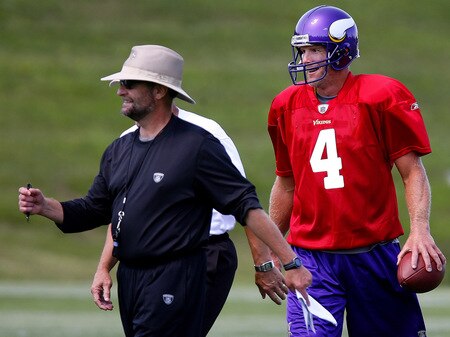 EDEN PRAIRIE, MN - AUGUST 18:  Minnesota Vikings Head Coach Brad Childress (L) walks with Brett Favre #4 after finishing  a passing drill during a Minnesota Vikings practice session on August 18, 2009 at Winter Park in Eden Prairie, Minnesota. Favre has reportedly agreed to play for the Vikings, a reversal of his announced retirement.  <br /><br /><span class="help">(Photo by Scott A. Schneider/Getty Images)</span>