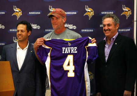 EDEN PRAIRIE, MN - AUGUST 18: Brett Favre (C), Mark Wilf (L) and Zygi Wilf show the media Favre's Minnesota Vikings jersey on August 18, 2009 at Winter Park in Eden Prairie, Minnesota. <br /><br /><span class="help">(Photo by Scott A. Schneider/Getty Images)</span>