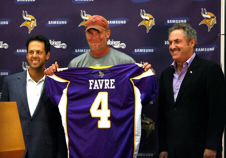 EDEN PRAIRIE, MN - AUGUST 18: Brett Favre (C), Mark Wilf (L) and Zygi Wilf show the media Favre's Minnesota Vikings jersey on August 18, 2009 at Winter Park in Eden Prairie, Minnesota. <br /><br /><span class="help">(Photo by Scott A. Schneider/Getty Images)</span>