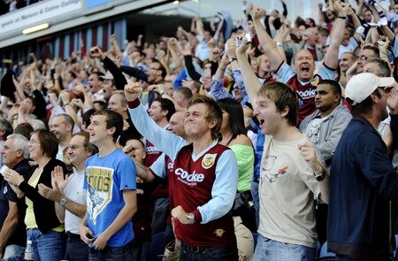 BURNLEY, ENGLAND - AUGUST 19:  Burnley fans celebrate a goal during the Barclays Premier League match between Burnley and Manchester United at Turf Moor on August 19, 2009 in Burnley, England.  <br /><br /><span class="help">(Photoby Laurence Griffiths/Getty Images)</span>
