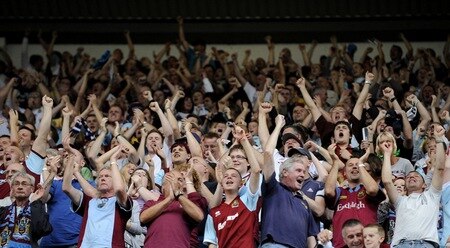 BURNLEY, ENGLAND - AUGUST 19:   Burnley fans celebrate the goal during the Barclays Premier League match between Burnley and Manchester United at Turf Moor on August 19, 2009 in Burnley, England.  <br /><br /><span class="help">(Photoby Laurence Griffiths/Getty Images)</span>