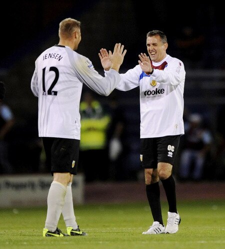 BURNLEY, ENGLAND - AUGUST 19:  Brian Jensen of Burnley is congratulated by his manager Owen Coyle after the Barclays Premier League match between Burnley and Manchester United at Turf Moor on August 19, 2009 in Burnley, England.  <br /><br /><span class="help">(Photoby Laurence Griffiths/Getty Images)</span>