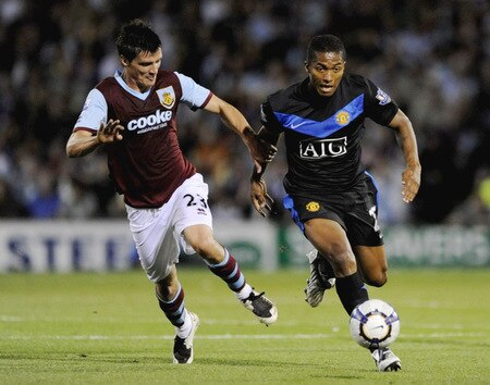 BURNLEY, ENGLAND - AUGUST 19:  Stephen Jordan of Burnley chases Antonio Valencia of Manchester United during the Barclays Premier League match between Burnley and Manchester United at Turf Moor on August 19, 2009 in Burnley, England.  <br /><br /><span class="help">(Photoby Laurence Griffiths/Getty Images)</span>