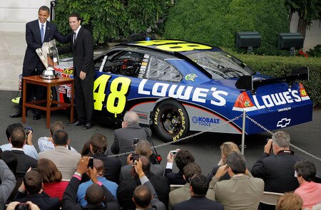 WASHINGTON - AUGUST 19:  U.S. President Barack Obama poses for photgraphs with NASCAR driver Jimmie Johnson during an event honoring Johnson, the 2008 Sprint Cup Champion, at the White House August 19, 2009 in Washington, DC. NASCAR drivers Carl Edwards, Greg Biffle, Clint Bowyer, Jeff Burton, Jeff Gordon, Denny Hamlin, Tony Stewart and Dale Earnhardt Jr. also attended the ceremony.  <br /><br /><span class="help">(Photo by Chip Somodevilla/Getty Images)</span>