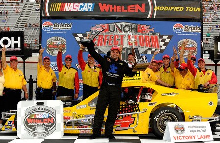BRISTOL, TN - AUGUST 19:  Donny Lia, driver of the #4 Mystic Missel Dodge celebrates in Victory Lane with his crew after winning the NASCAR Whelen Modified Tour at Bristol Motor Speedway on August 19, 2009 in Bristol, Tennessee.  <br /><br /><span class="help">(Photo by Rusty Jarrett/Getty Images for NASCAR)</span>