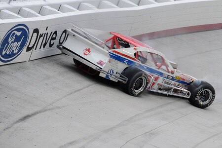 BRISTOL, TN - AUGUST 19:  Gene Pack driver of the #31 Comtech Soulutions /Wings-N-Things Chevrolet, spins in turn two duirng the NASCAR Whelen Modified Tour at Bristol Motor Speedway on August 19, 2009 in Bristol, Tennessee.  <br /><br /><span class="help">(Photo by John Harrelson/Getty Images for NASCAR)</span>