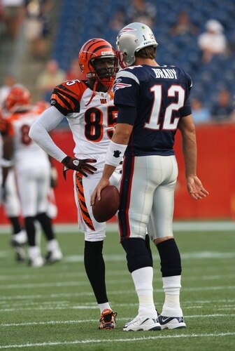 FOXBORO, MA - AUGUST 20:  Chad Ochocinco #85 of the Cincinnati Bengals talks with Tom Brady #12 of the New England Patriots during their preseason game at Gillette Stadium on August 20, 2009 in Foxboro, Massachusetts.  <br /><br /><span class="help">(Photo by Jim Rogash/Getty Images)</span>