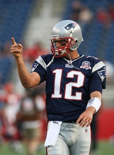 FOXBORO, MA - AUGUST 20:  Tom Brady #12 of the New England Patriots gestures during warm ups against the Cincinnati Bengals during their preseason game at Gillette Stadium on August 20, 2009 in Foxboro, Massachusetts.  <br /><br /><span class="help">(Photo by Jim Rogash/Getty Images)</span>