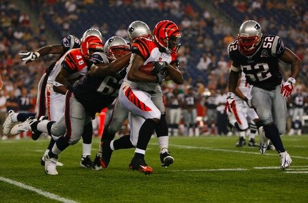 FOXBORO, MA - AUGUST 20:  James Johnson #39 of the Cincinnati Bengals runs the ball against Rich Ohrnberger #62 and Eric Alexander #52 the New England Patriots during their preseason game at Gillette Stadium on August 20, 2009 in Foxboro, Massachusetts.  <br /><br /><span class="help">(Photo by Jim Rogash/Getty Images)</span>