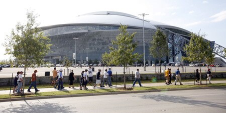 ARLINGTON, TX - AUGUST 21:  Football fans make their way to Cowboys Stadium before the Dallas Cowboys take on the Tennessee Titans on August 21, 2009 in Arlington, Texas.  <br /><br /><span class="help">(Photo by Tom Pennington/Getty Images)</span>