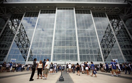 ARLINGTON, TX - AUGUST 21:  Football fans wait for the doors to open at Cowboys Stadium before the Dallas Cowboys take on the Tennessee Titans on August 21, 2009 in Arlington, Texas.  <br /><br /><span class="help">(Photo by Tom Pennington/Getty Images)</span>