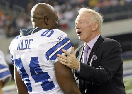 ARLINGTON, TX - AUGUST 21:  Dallas Cowboys team owner Jerry Jones talks with linebacker DeMarcus Ware #94 prior to the Cowboys taking the field against the Tennessee Titans during a preseason game at Cowboys Stadium on August 21, 2009 in Arlington, Texas. <br /><br /><span class="help">(Photo by Tom Pennington/Getty Images)</span>