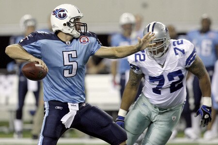 ARLINGTON, TX - AUGUST 21:  Quarterback Kerry Collins #5 of the Tennessee Titans looks for an open receiver in the first quarter as defensive end Stephen Bowen #72 of the Dallas Cowboys during a preseason game at Cowboys Stadium on August 21, 2009 in Arlington, Texas. <br /><br /><span class="help">(Photo by Tom Pennington/Getty Images)</span>