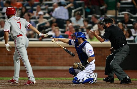 NEW YORK - AUGUST 22:  Pedro Feliz #7 of the Philadelphia Phillies is walked by the New York Mets during the game on August 22, 2009 at Citi Field in the Flushing neighborhood of the Queens borough of New York City.  <br /><br /><span class="help">(Photo by Jared Wickerham/Getty Images)</span>