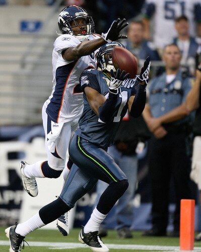 SEATTLE - AUGUST 22:  Wide receiver Deon Butler #11 of the Seattle Seahawks halls in a touchdown catch against Andre Goodman #21 of the Denver Broncos on August 22, 2009 at Qwest Field in Seattle, Washington. <br /><br /><span class="help">(Photo by Otto Greule Jr/Getty Images)</span>