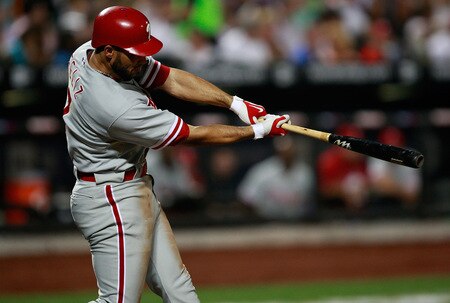 NEW YORK - AUGUST 22:  Pedro Feliz #7 of the Philadelphia Phillies hits an RBI against the New York Mets during the game on August 22, 2009 at Citi Field in the Flushing neighborhood of the Queens borough of New York City.  <br /><br /><span class="help">(Photo by Jared Wickerham/Getty Images)</span>
