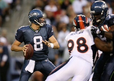SEATTLE - AUGUST 22:  Quarterback Matt Hasselbeck #8 of the Seattle Seahawks passes under pressure from Ryan McBean #98 of the Denver Broncos on August 22, 2009 at Qwest Field in Seattle, Washington. <br /><br /><span class="help">(Photo by Otto Greule Jr/Getty Images)</span>